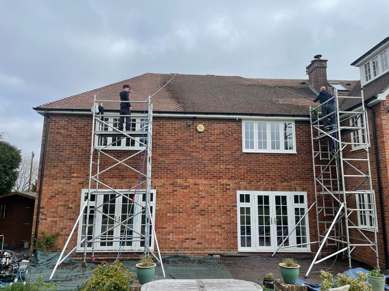 Roof cleaning carried out safely from scaffold towers by The Roof Moss Cleaners in Ludgershall
